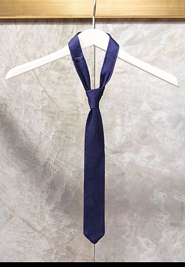 Navy blue men’s knitted tie