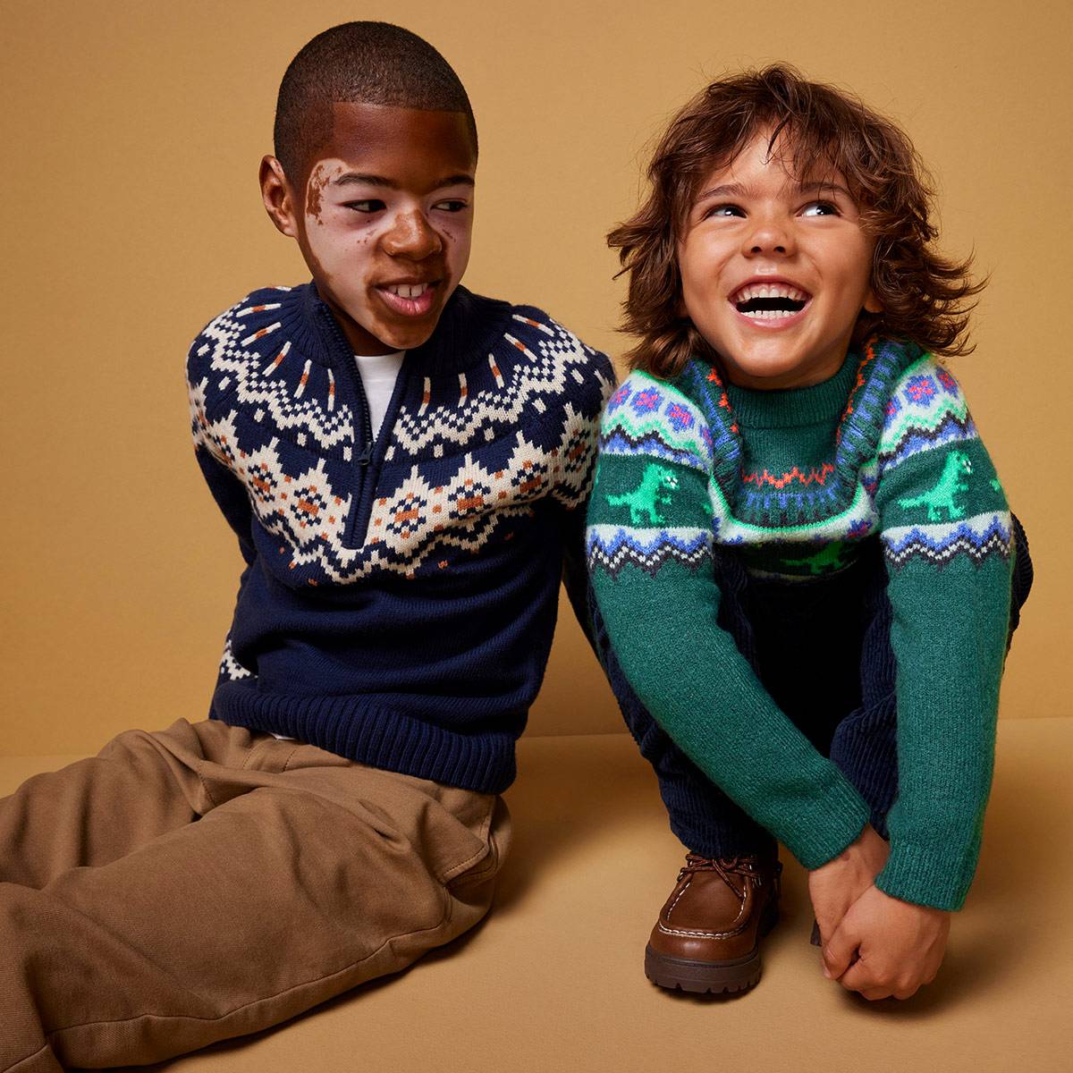 Boys wearing Christmas jumpers. Shop Christmas jumpers