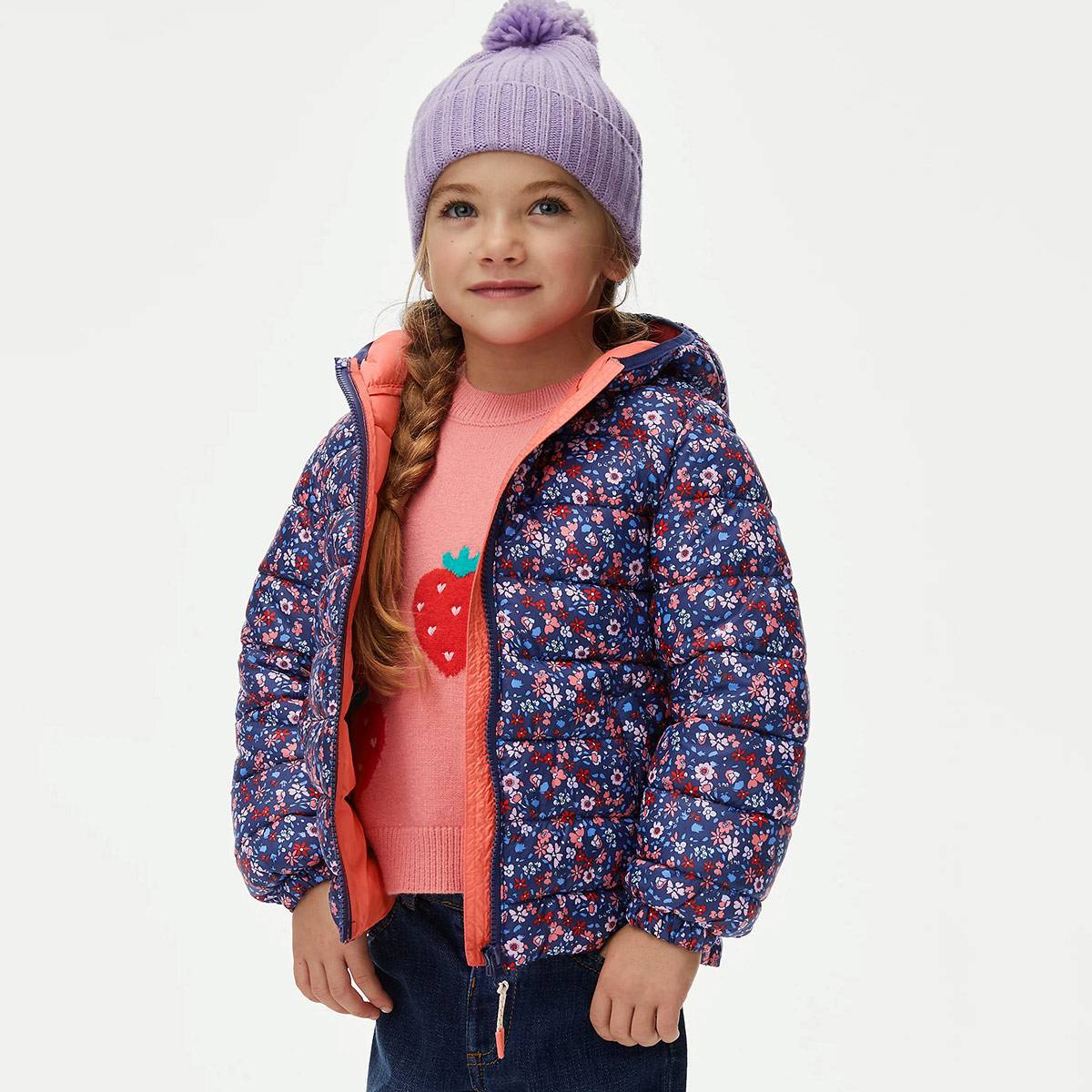 Girl wearing floral navy coat and lilac hat