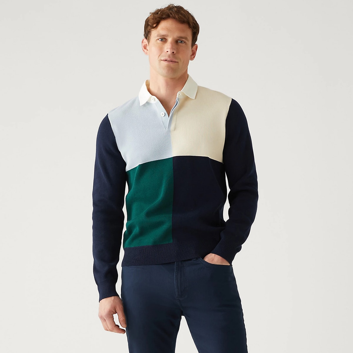 Model wearing a colour-block rugby-style top. Shop tops